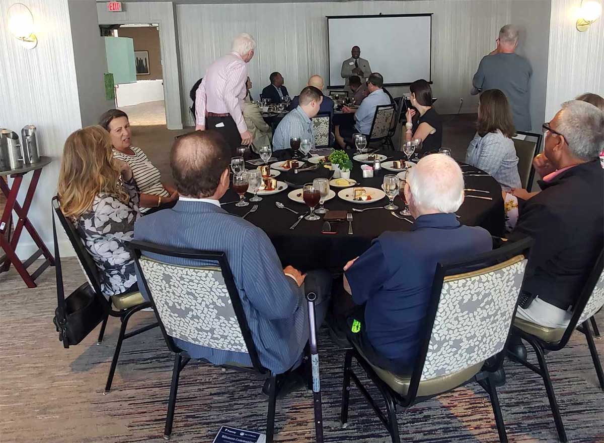 Biltmore Area Partnership luncheon with members networking and listening to a speaker