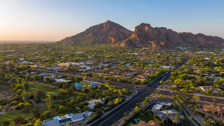 Aerial view of Camelback Mountain and Camelback East Village at sunrise in Phoenix, Arizona